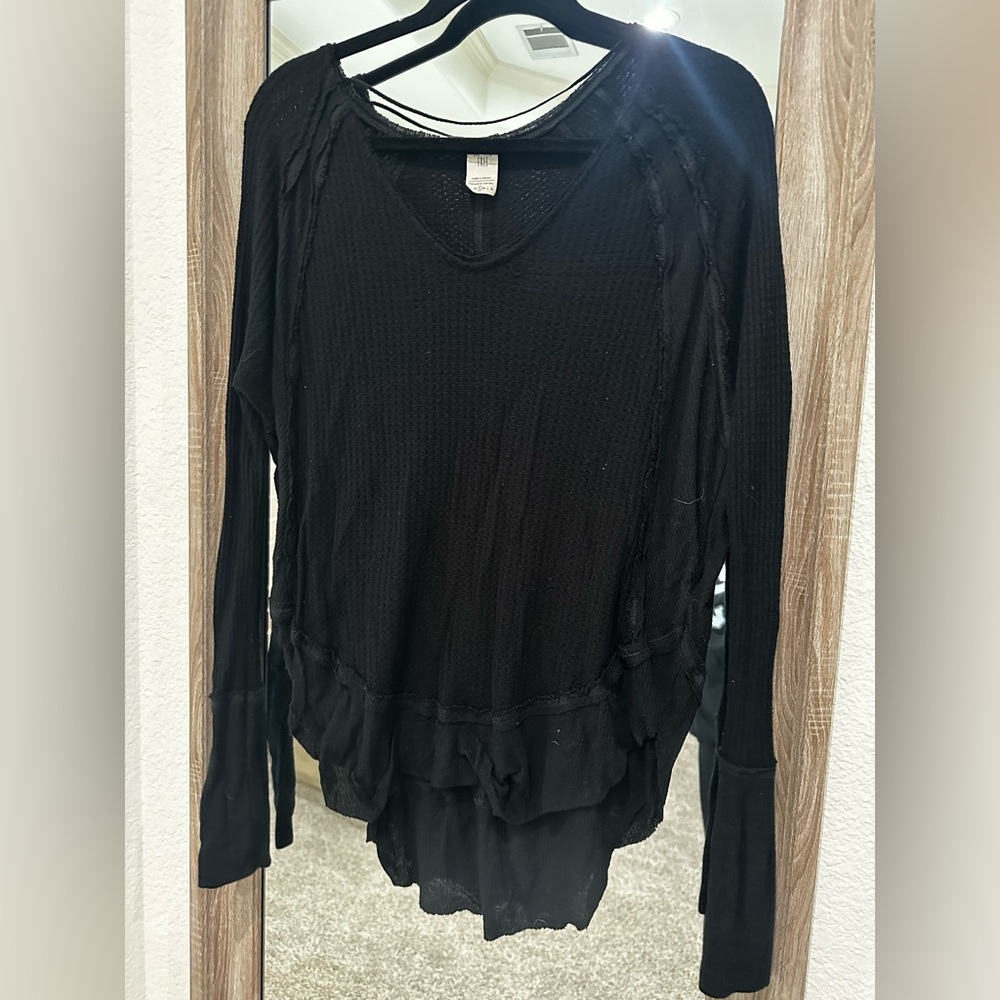 We the Free black waffle tunic, small hole in back neckline can be easily sewn.